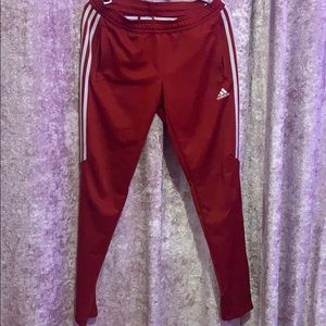 Red and white adidas track pants
